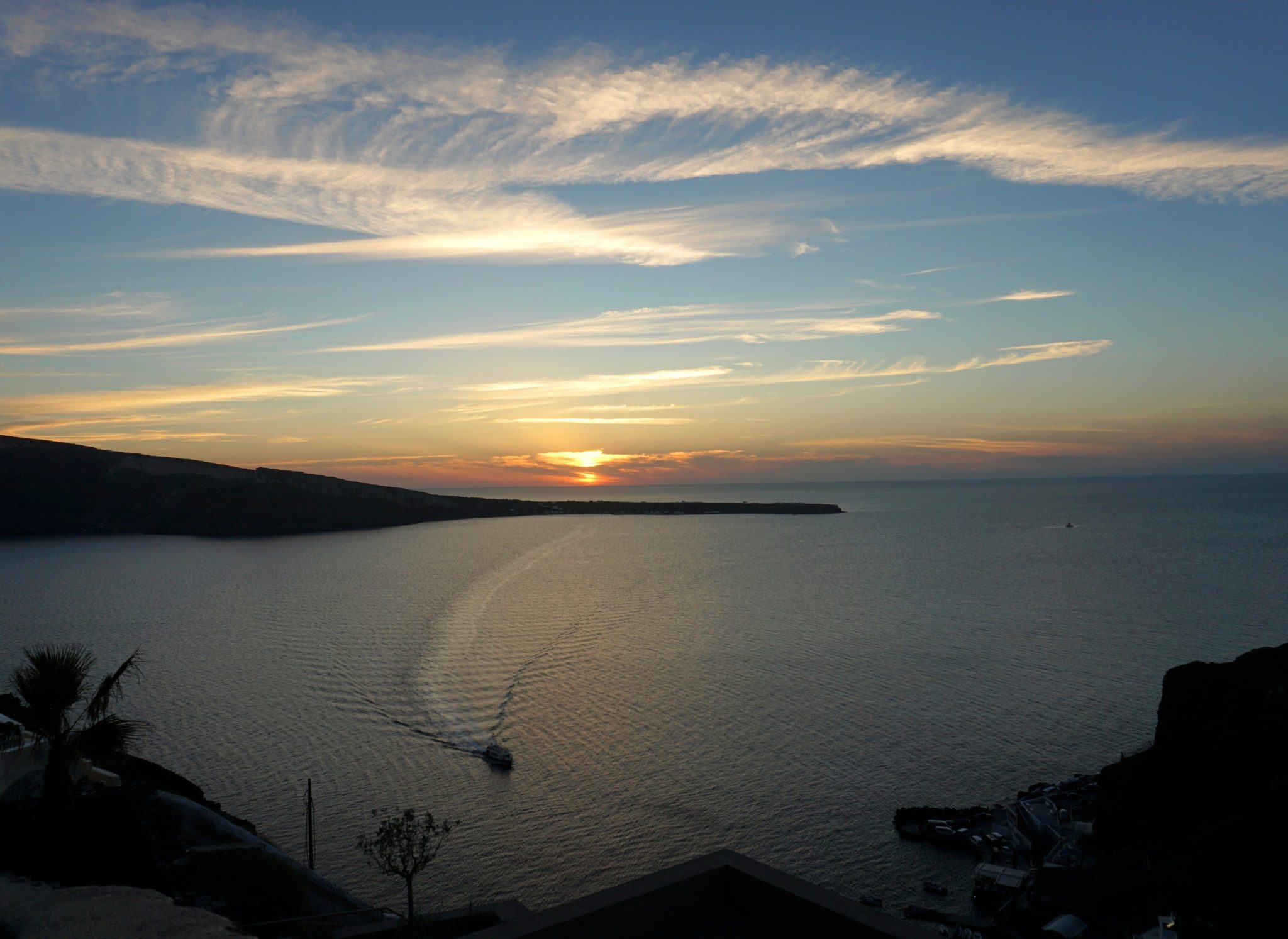 Watching the sunset in Oia from the steps down to Amoudi Bay. A reward for doing the Fira to Oia hike.